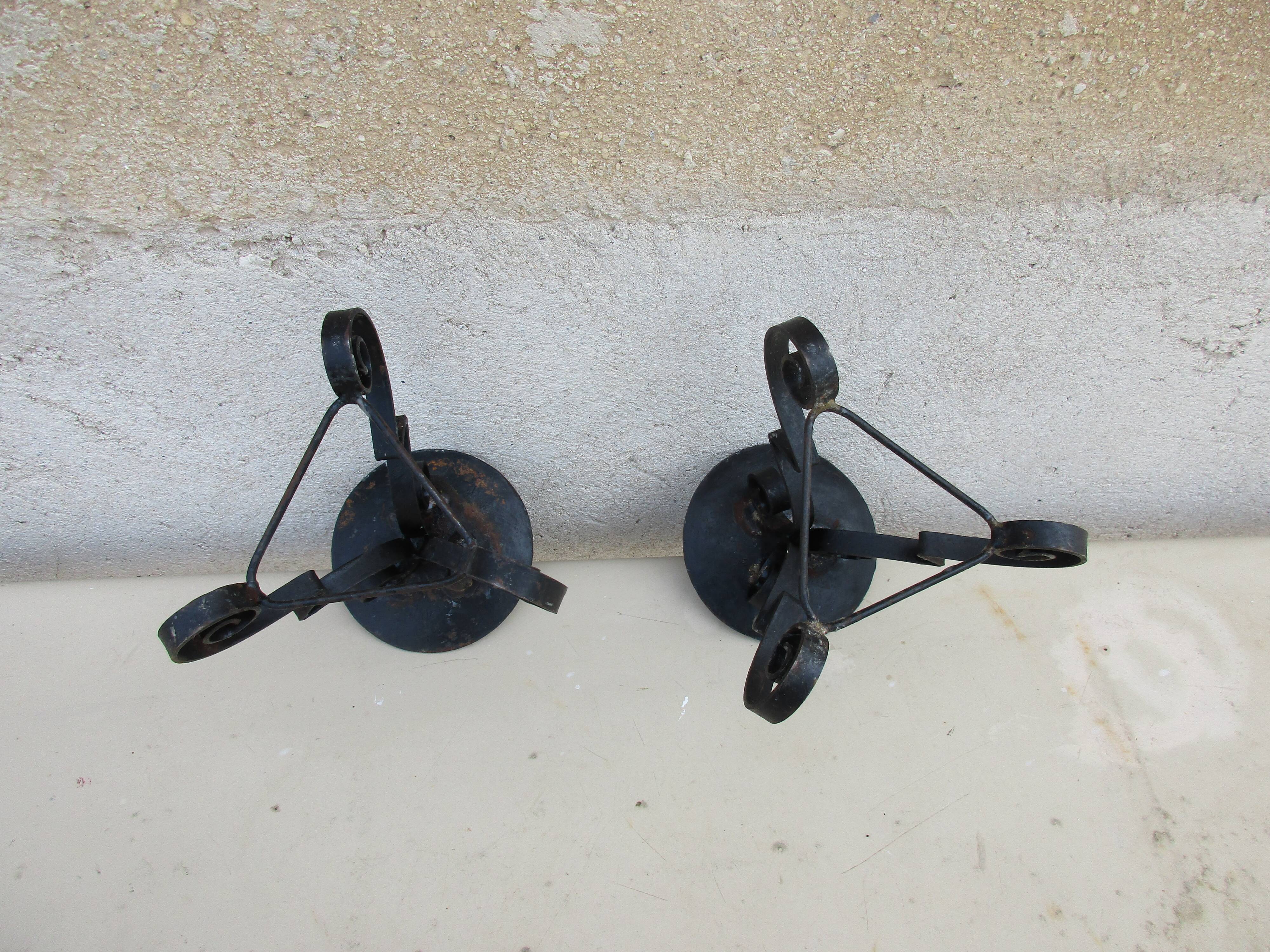 Pair of iron candlesticks