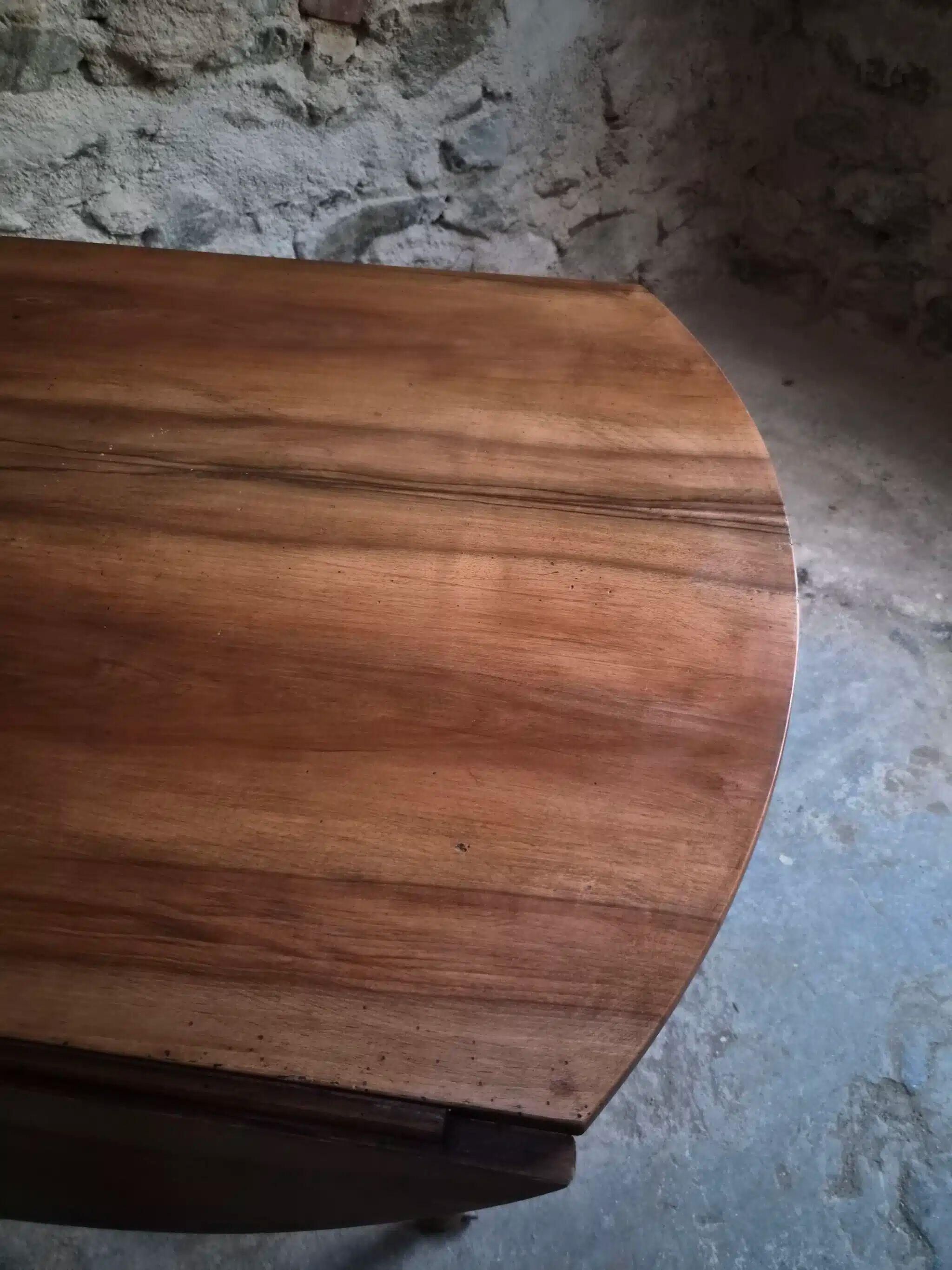 Antique drop-leaf dining table in walnut, France, circa 1900.