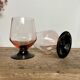 4 pink glasses with black stems