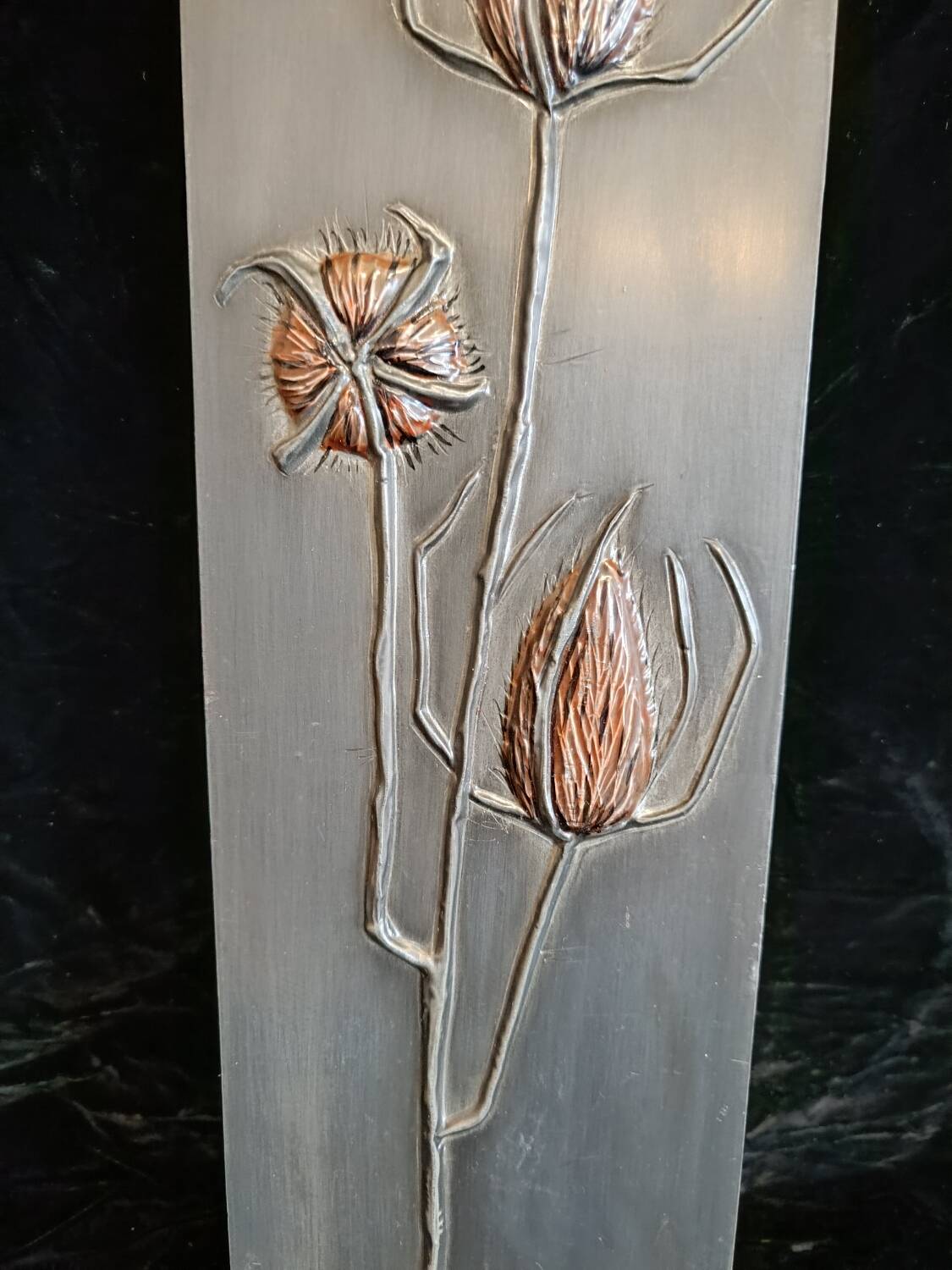 Bas-relief in embossed tin