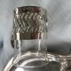 6 small glasses in their silver metal holder, with handle