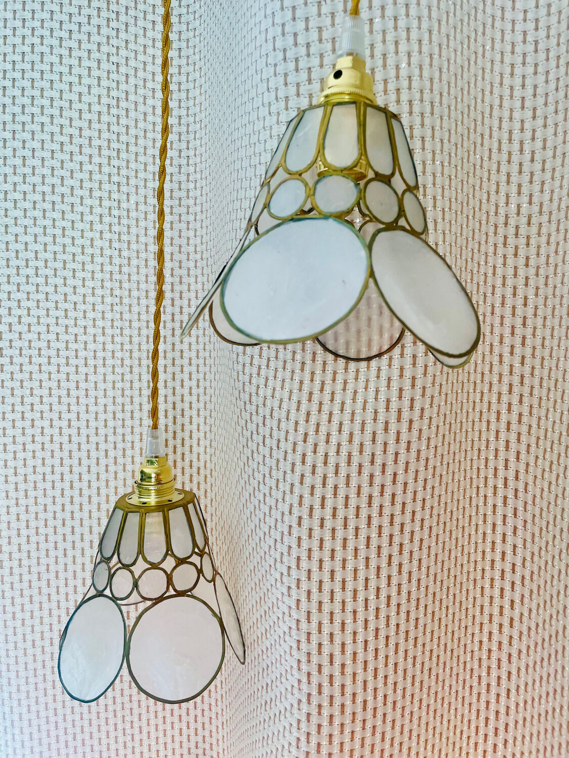 Pair of portable lamps with mother-of-pearl lampshades and brass.
