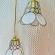 Pair of portable lamps with mother-of-pearl lampshades and brass.