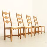 Four oak dining chairs by Henning Kjaernulf.