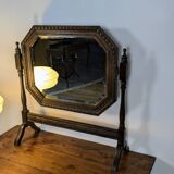 Antique beveled octagonal vanity mirror in carved wood