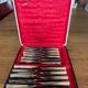 Service of 24 classic knives with natural bone handles - original case from 1950.