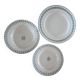 Old green-blue faience plates and dishes with geometric patterns.