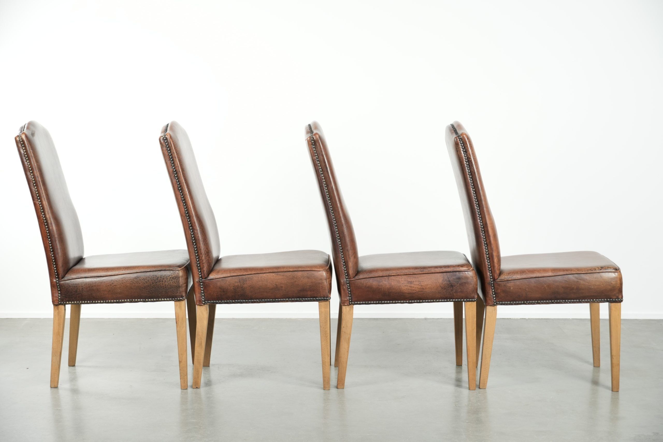 Vintage set of 4 dining chairs made of sheepskin leather with a high back