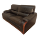 Black leather sofa and wooden armrests