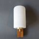1960 wall light in gilded brass and rosewood.