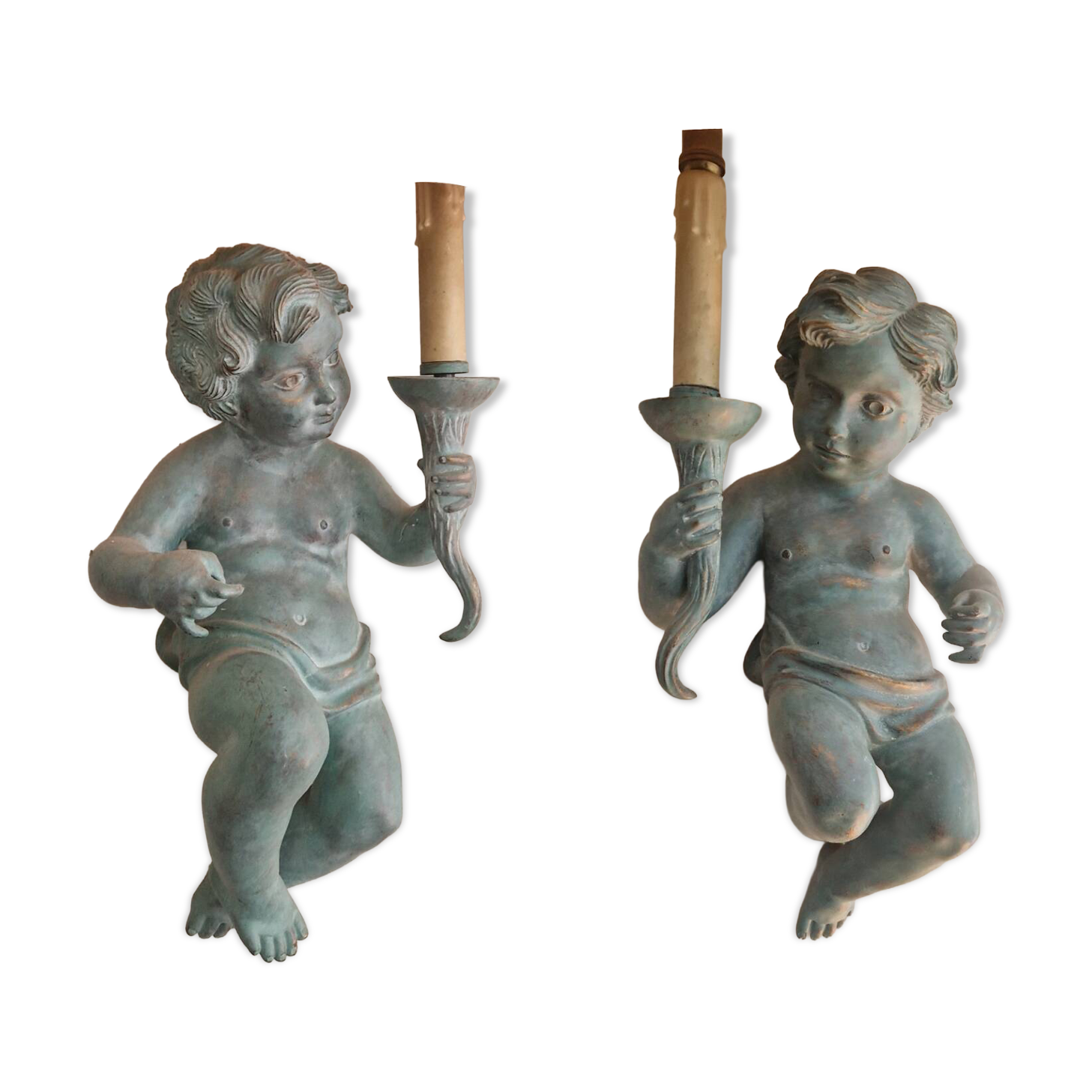 Pairs of wall lights, either two distinct cherubs.