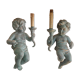 Pairs of wall lights, either two distinct cherubs.
