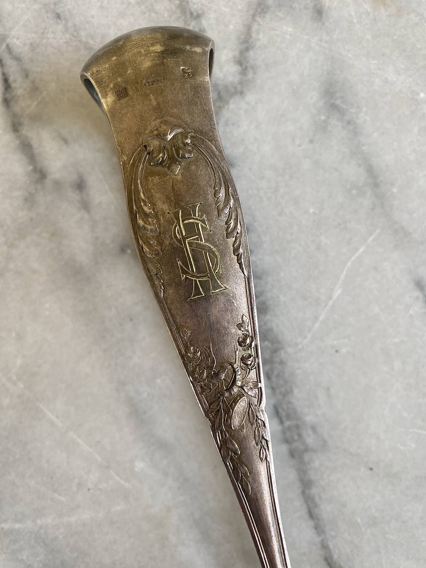 Antique silver-plated sugar tongs SFAM with monogram.