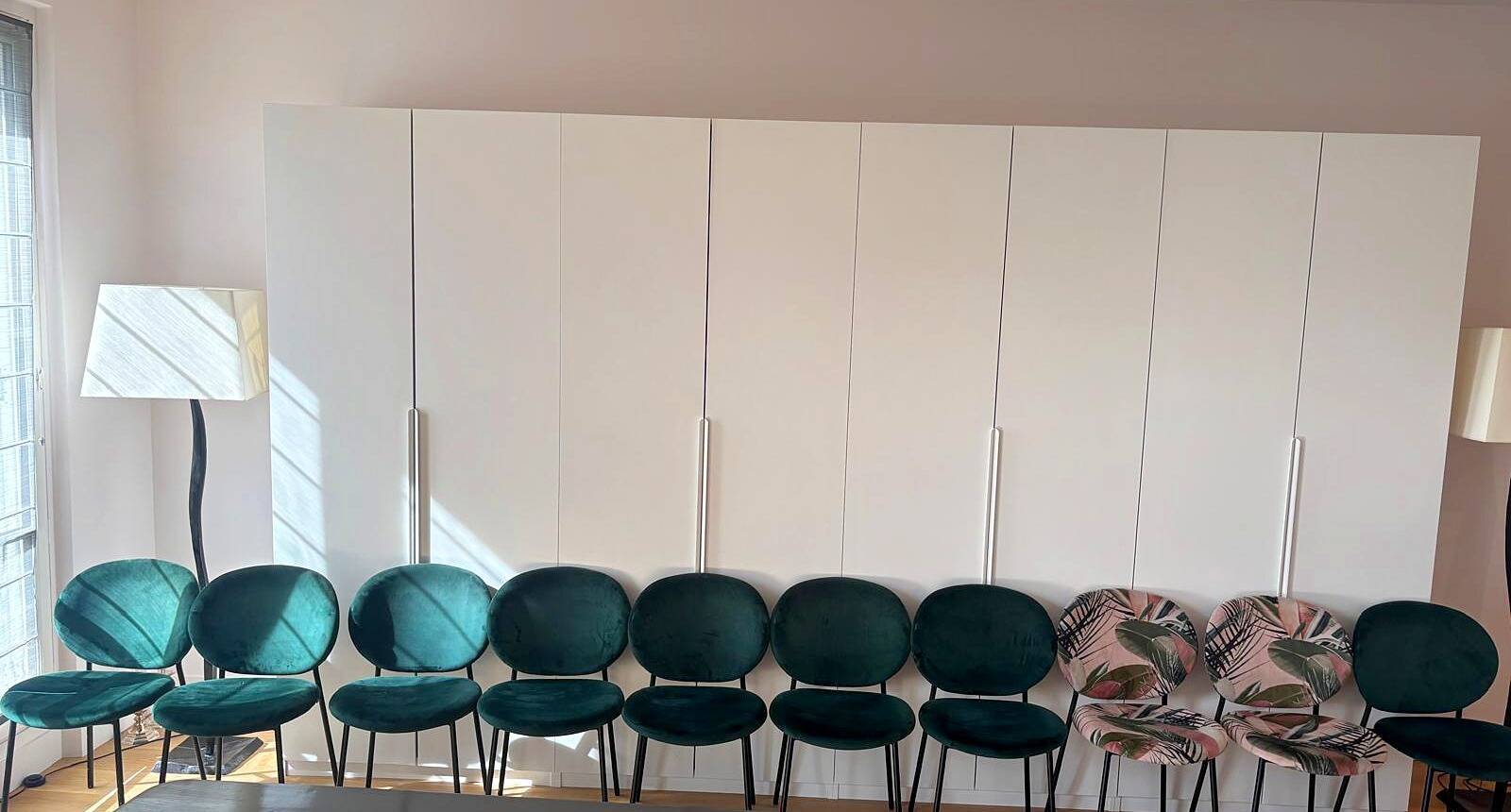 Set of 10 Calligaris Ines chairs in green velvet and tropical fabric.