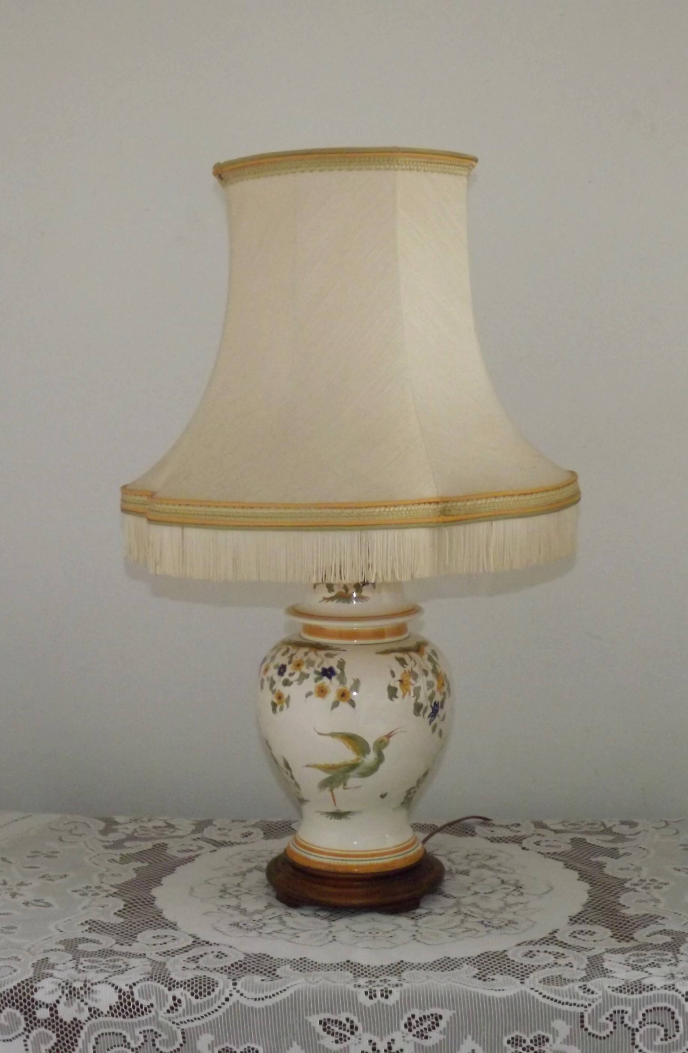 Table lamp with wooden base and fringed shade