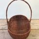 Former collection in braided wicker rattan with cove decoration vintage basket