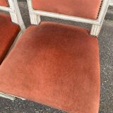 2 Louis XVI chairs in solid wood and orange velvet.