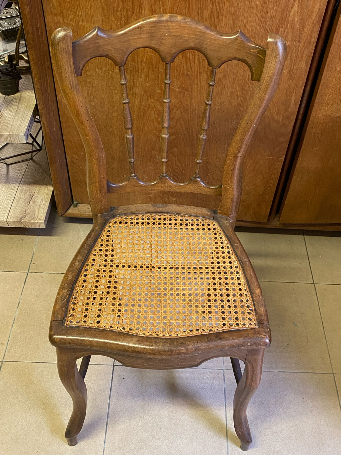 Antique wooden chair, cane seat