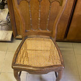Antique wooden chair, cane seat