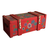 Red wooden trunk with floral patterns