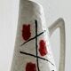 Ceramic pitcher with hand painted floral pattern
