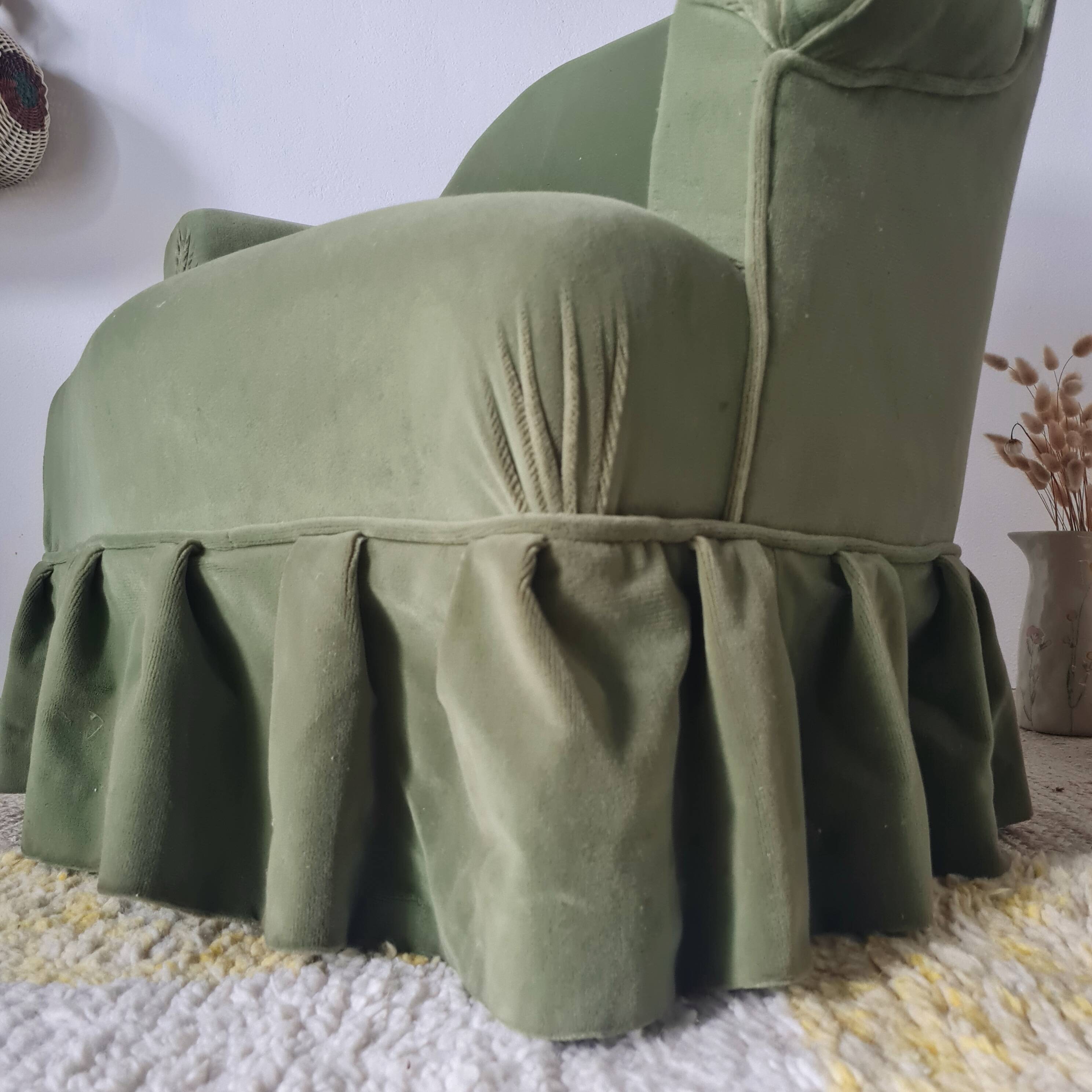 Green velvet armchair