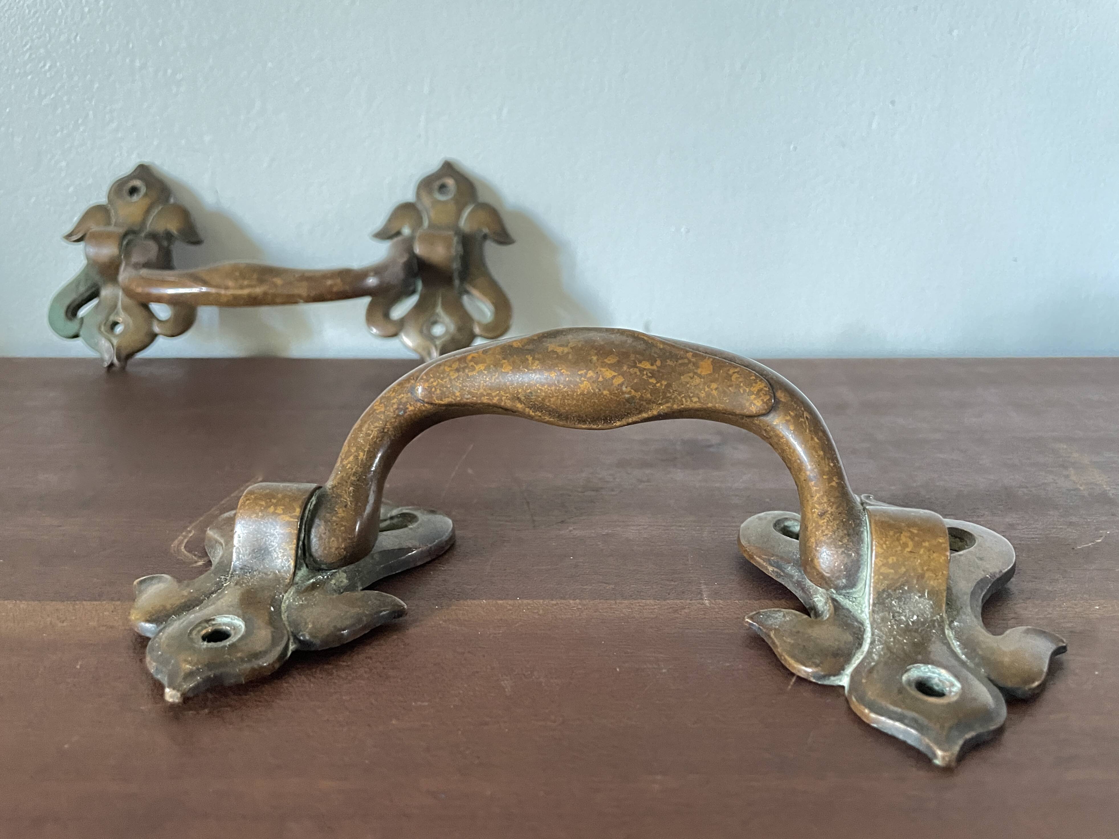 Pair of bronze handles by Emile Muller, 19th century.