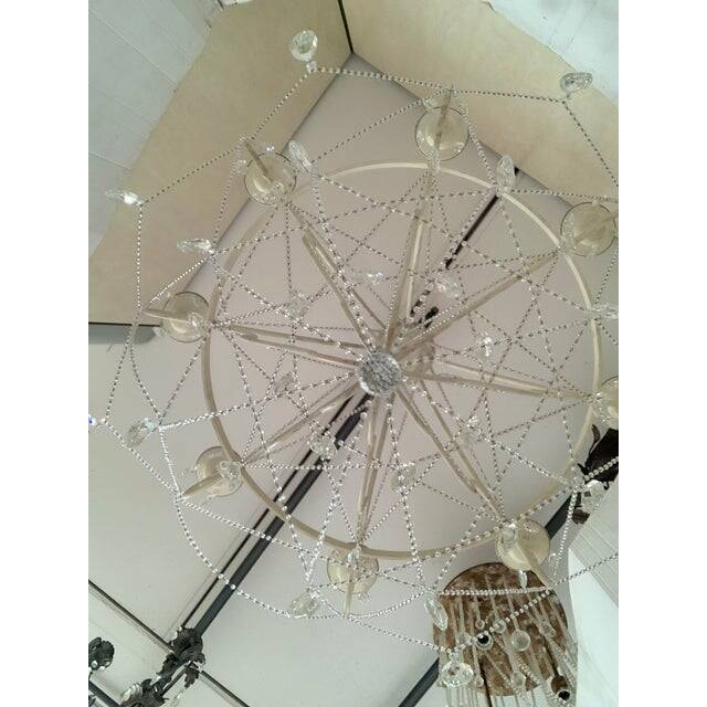 Contemporary ivory florentine iron and crystals chandelier