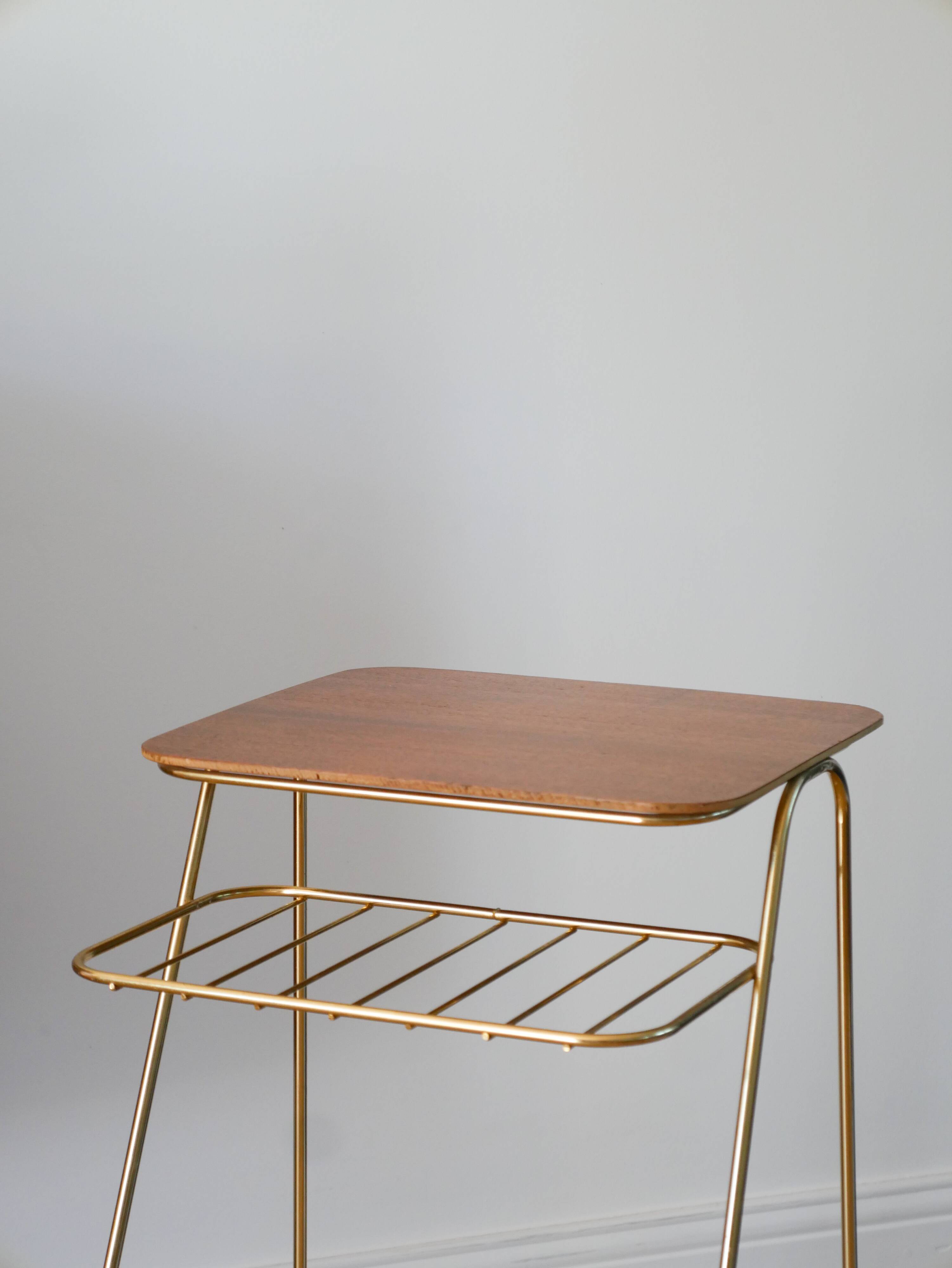 Small brass side table with a teak top, 1960.