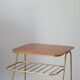 Small brass side table with a teak top, 1960.