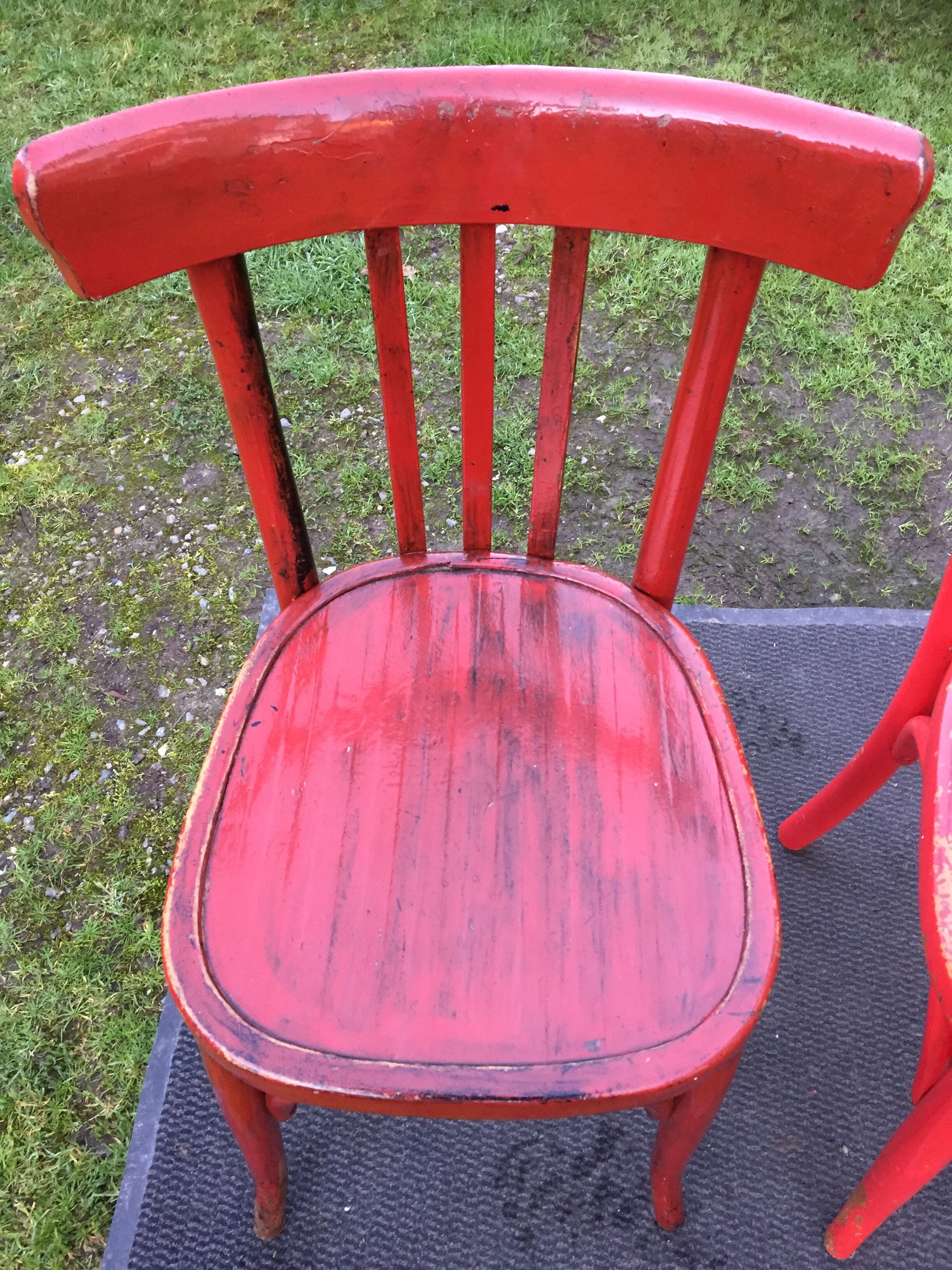 Vintage bistro chairs painted in burgundy and red
