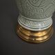 Napoleon III lamp in green cecidon on a brass base
