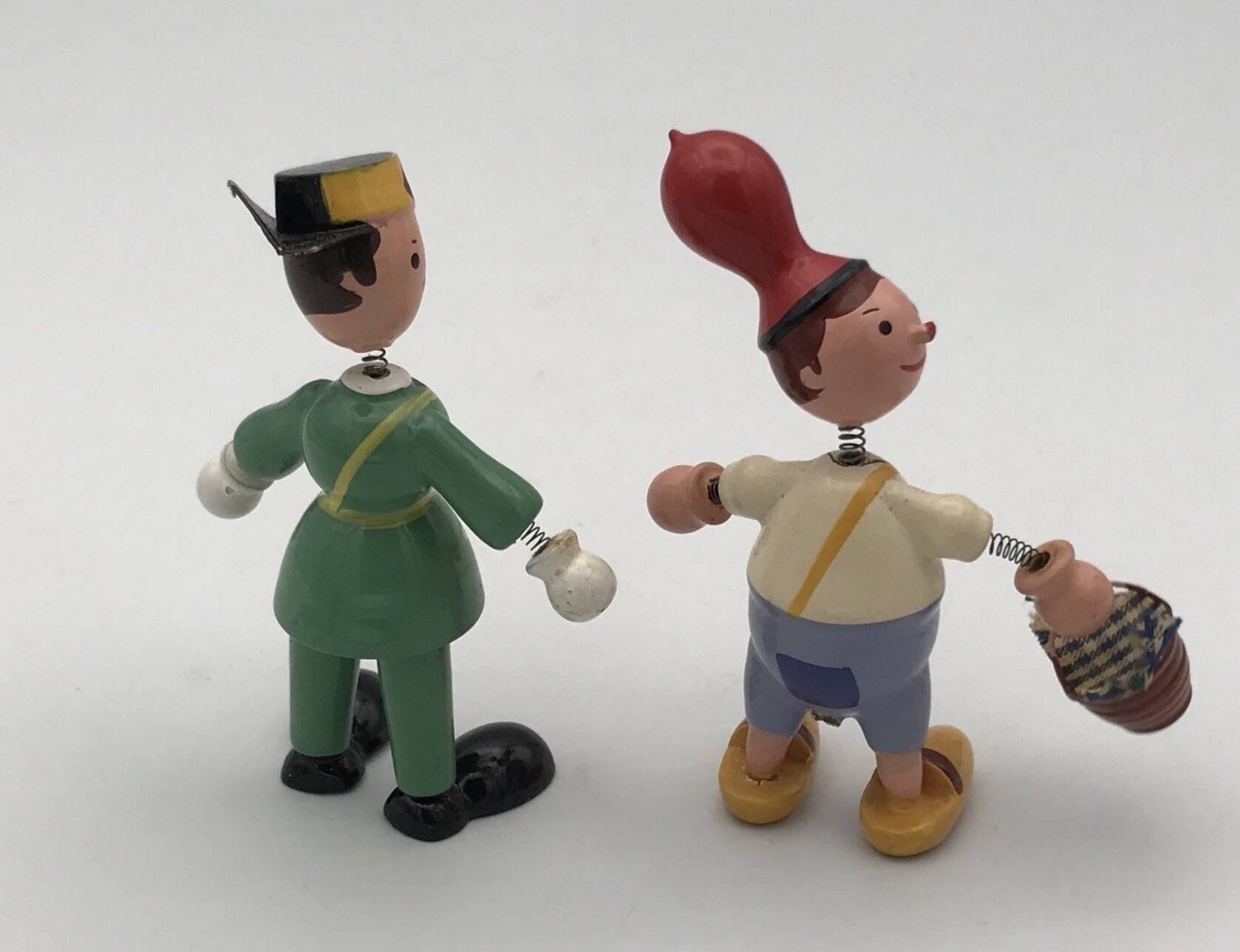 Set of 2 vintage GOULA wooden toy figurines with spring.