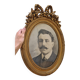 Antique medallion frame in gilded stucco with its period portrait.