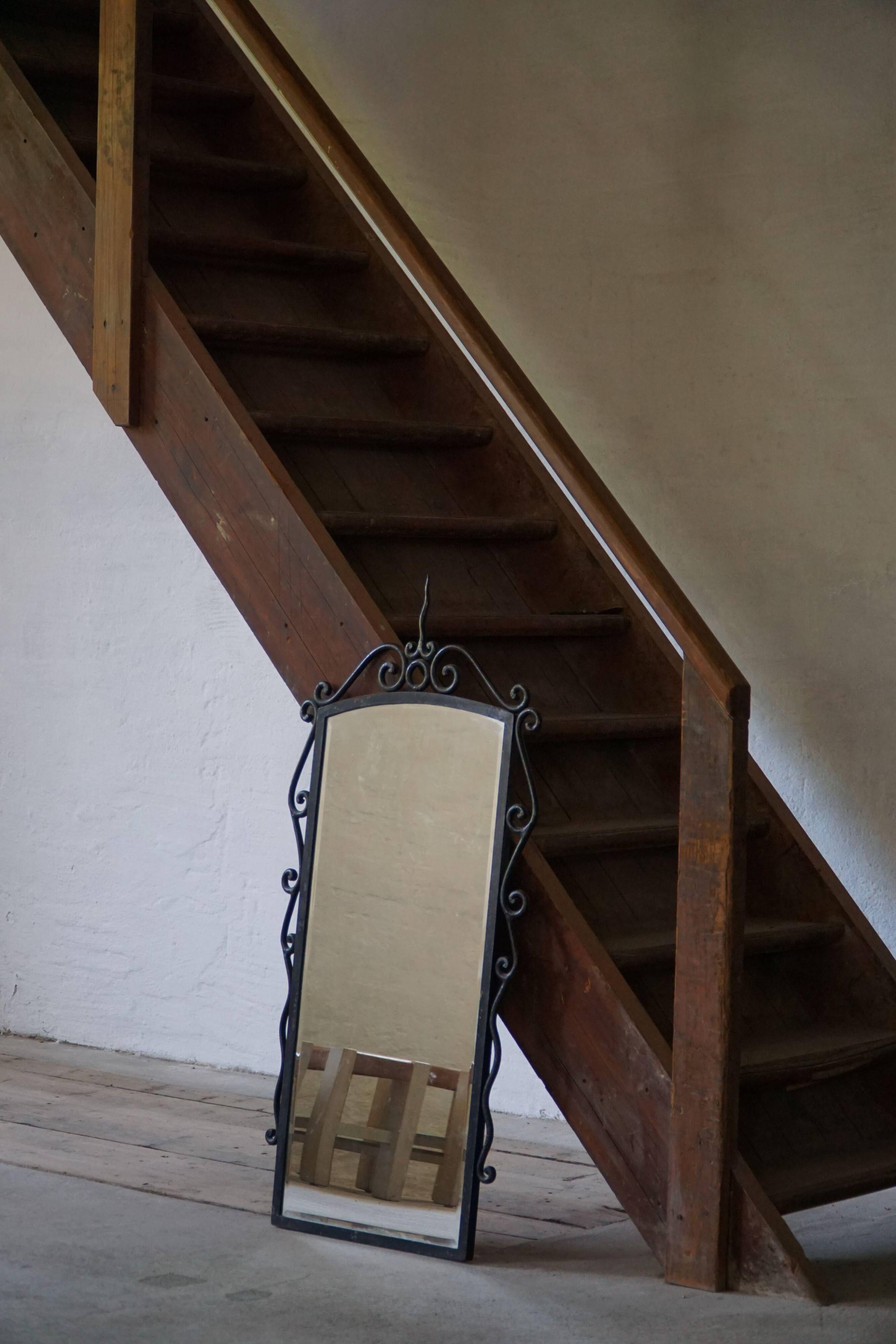 French mid-century brutalist wall mirror in wrought iron, made in the 1950s.