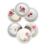 Old mismatched earthenware dinner plates