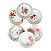 Old mismatched earthenware dinner plates