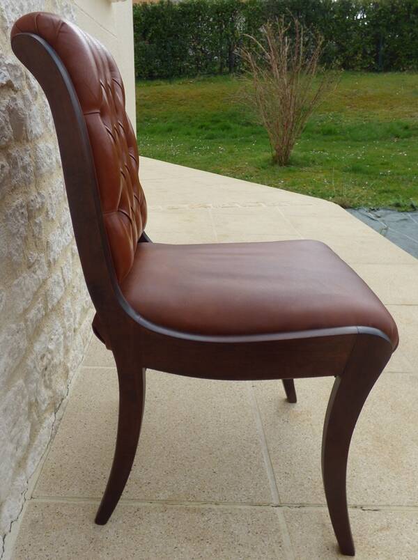 Chic Vintage Chesterfield style chair with wooden frame and faux leather