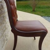 Chic Vintage Chesterfield style chair with wooden frame and faux leather