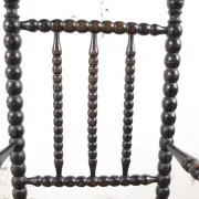 Black bobbin chair with armrests and rush seat – ca. 1900-1930
