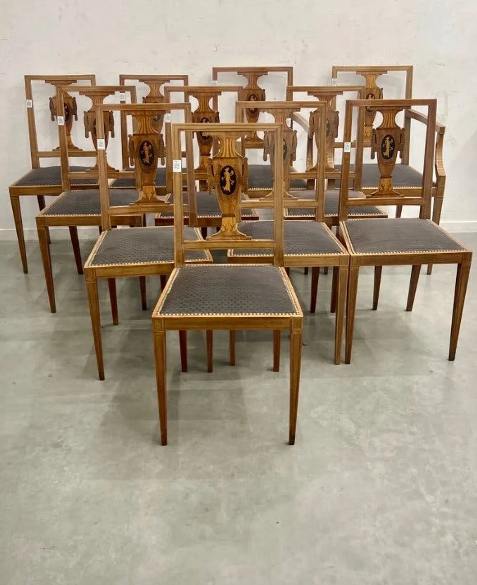 Set of 9 neoclassical chairs and 2 armchairs in marquetry.