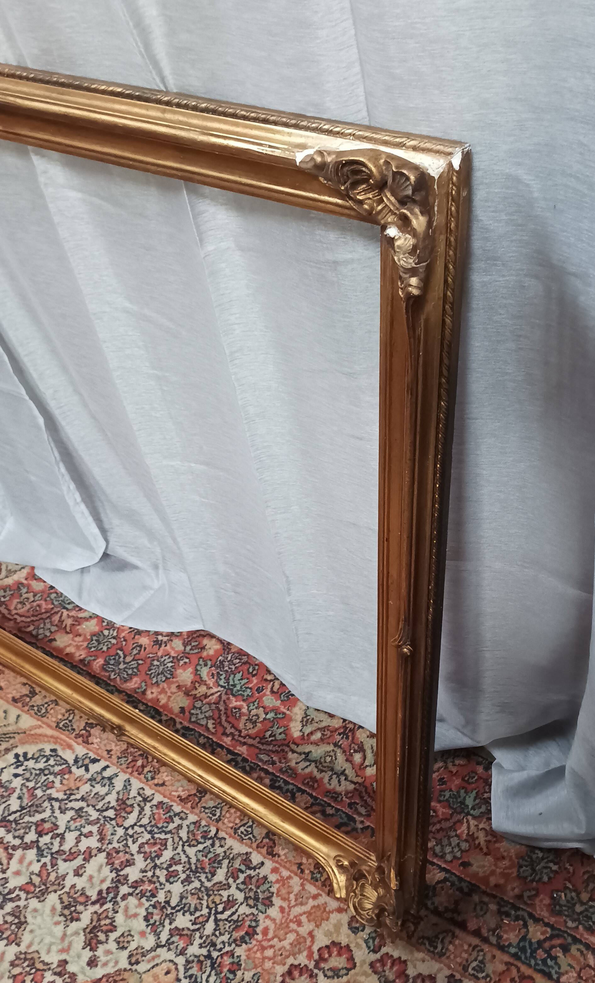 Old frame in wood and gilded stucco