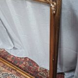 Old frame in wood and gilded stucco