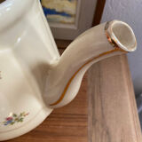 Old teapot or coffee maker in English style.