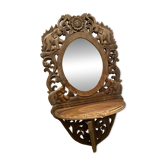 Carved mirror with integrated shelf
