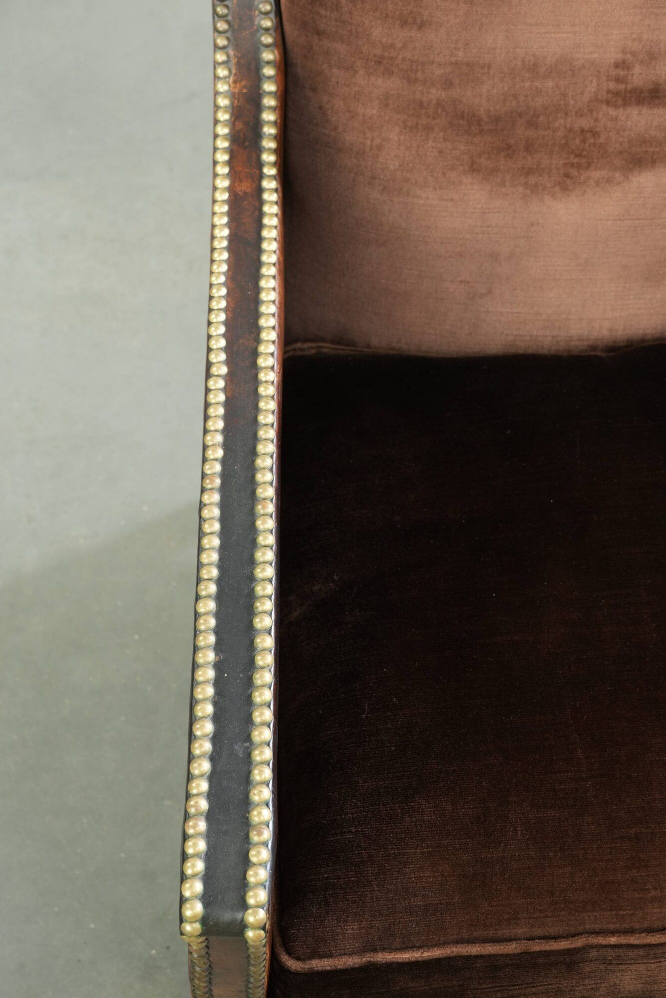 Art Deco design armchair finished in velvet and fitted with decorative nails
