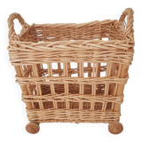 Vintage wicker basket on wheels - children's toy trolley