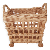 Vintage wicker basket on wheels - children's toy trolley