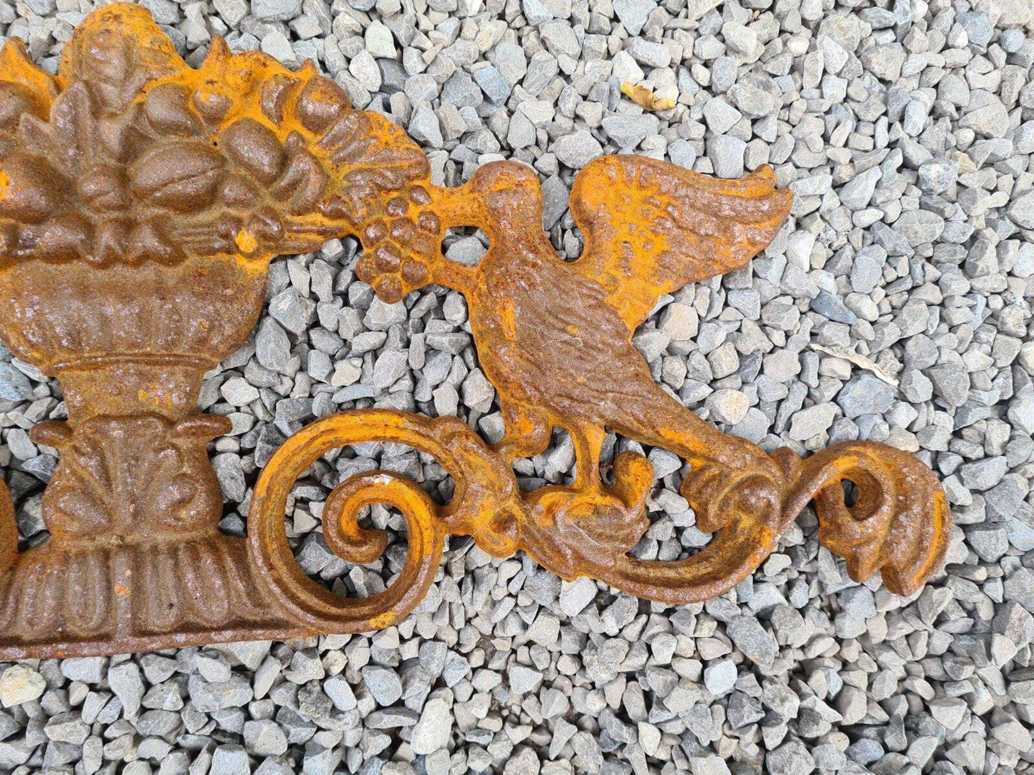 Cast iron pediment with birds