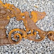 Cast iron pediment with birds